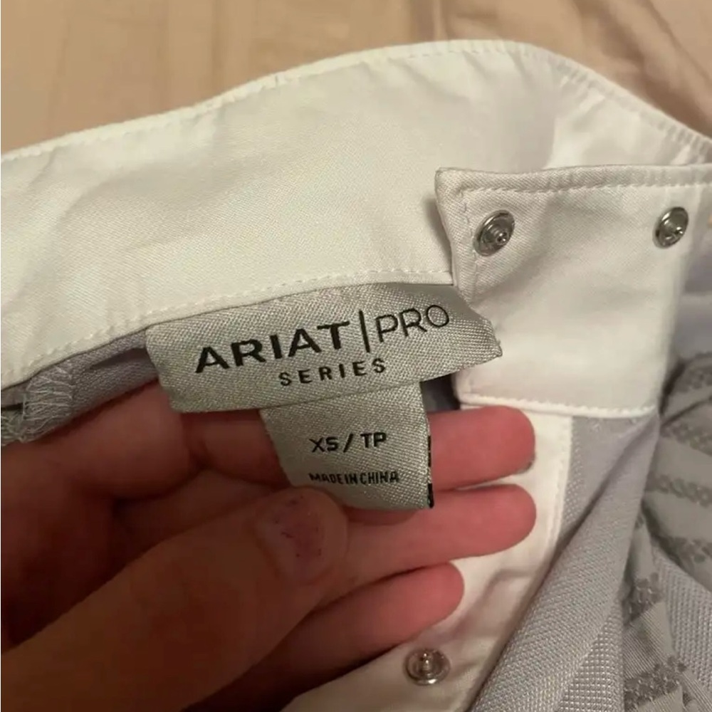 Never used. Horseback riding shirt.